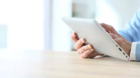Closeup of man's hand sliding on tablet screen Stock Footage 49759630