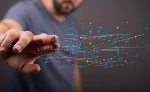 Closeup of the man's hand touching the virtual connections with binary numbers. Foto stock