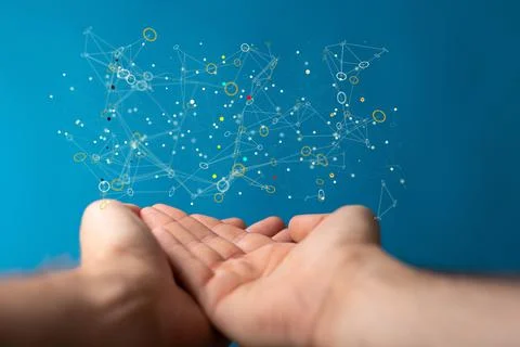 A closeup of a man's hands with a 3D render of a data server above it with a  Stock Photos