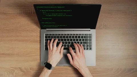 Closeup a man's hands are typing commands of a laptop keyboard. A man is writing Stock Footage 150159067