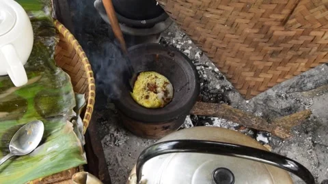 Closeup of a man's hands cooking Serabi Indonesian food Stock Footage 312806512