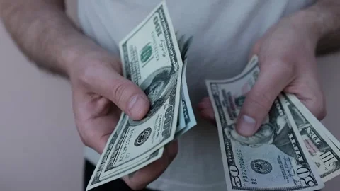 Closeup of man's hands counting dollar cash banknotes. Stock Footage 316920419