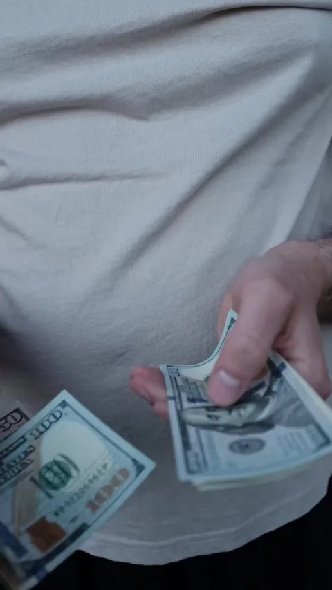 Closeup of man's hands counting dollar cash banknotes. Stock Footage 316920420