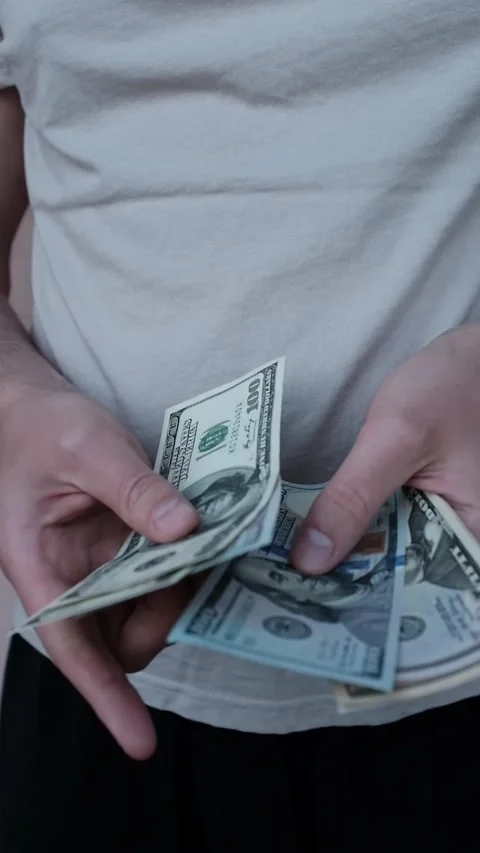 Closeup of man's hands counting dollar cash banknotes. Stock Footage 316920422
