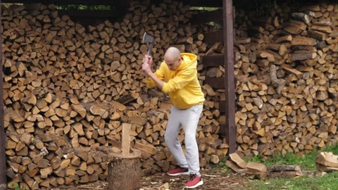 Closeup of mans hands with a log and a sharp vintage axe chop wood for fire heat Stock Footage 220682831