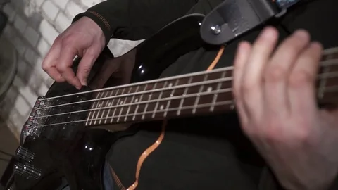 Closeup of man's hands playing the electric guitar Stock Footage 74208334