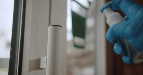 Closeup of man's hands using a sanitizer and a wet towel for desinfection of Stock Footage 129345030