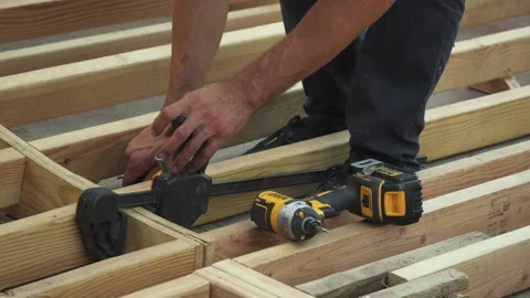 Closeup of Man's Hands Using Tools To Build DIY Skateboard Ramp in Backyard Video stock 158917155