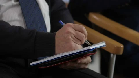 Closeup man's hands writing information at seminar Stock Footage 108008048