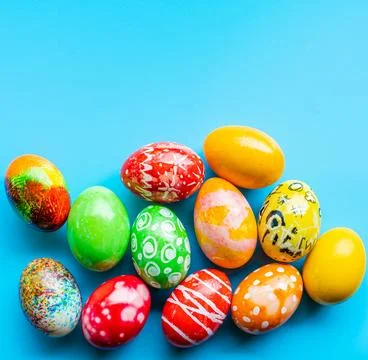 Closeup, many beautiful painted Easter eggs as blue background. the concept.. Stock Photos