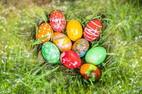 Closeup, many beautiful painted easter eggs as grass blurred background. co.. Stock Photos