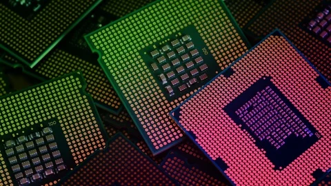 Closeup on many Computer CPU Chip rotating with color effects. Stock Footage 120303302