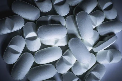 Closeup of many prescription drugs, medicine tablets or vitamin pills Stock Photos