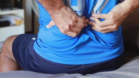 Closeup massaging back suffering from acute back pain arthritis backache acute Video stock 336585180