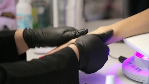 Closeup of master doing hands massage her female client after manicure procedure Stock Footage 80858100