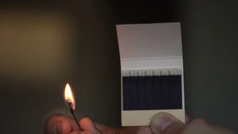 Closeup of a match setting a row of match heads on fire Stock Footage 82825681