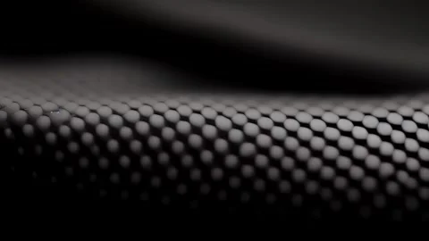 Closeup of a matte finish rubber texture with a small, uniform dot pattern. The Video stock 253605687