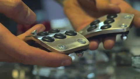 Closeup on mechanic's hands checking car details. Shallow DOF. 4K UHD. Video stock 77624306