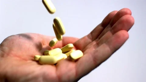 Closeup Of Medication Tablets Vitamins And Supplements. hand holding variety of Stock Footage 336586171