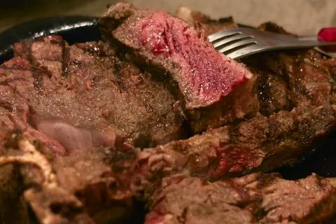 Closeup medium rare beef steak in hot plate Stock Photos