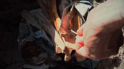 Closeup men's hands make a fire in mangal Stock Footage 167858463