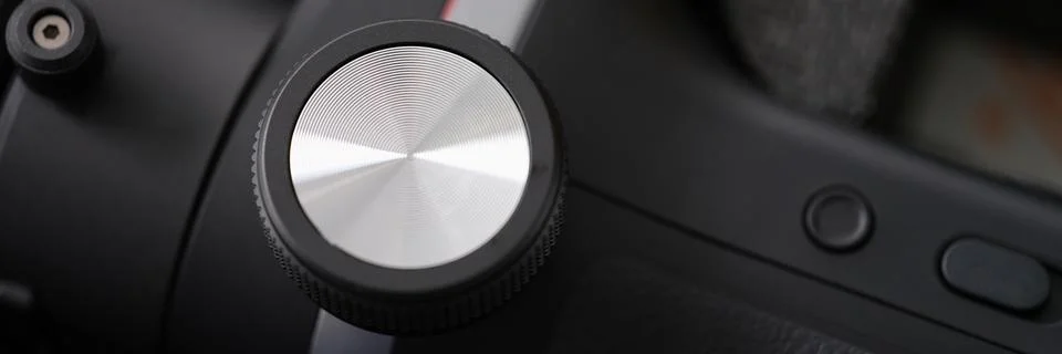 Closeup of metal button on control panel Photos