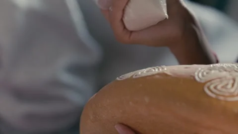 Closeup of Mexican Bread being decorated for the festival Stock Footage 270100030