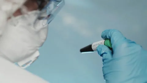 Closeup of microbiologist or medical worker hand with blue surgical gloves Stock-Footage 138261448