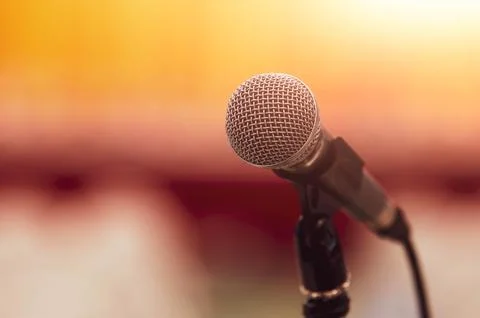 Closeup of microphone on abstract blurred background speech in seminar conv.. Stock Photos