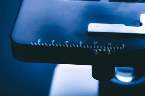 Closeup of microscope with metal lens, data analysis in the laboratory, sci.. Stock Photos