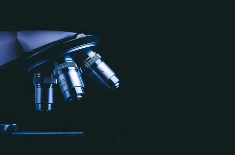 Closeup of microscope with metal lens, data analysis in the laboratory, sci.. Stock Photos
