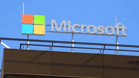 Closeup on a Microsoft logo and text on a building in an urban area - the blue Video stock 104182701