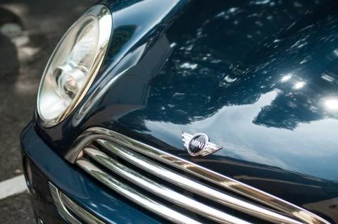 Closeup of Mini cooper front with logo parked in the street Stock Photos