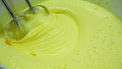 Closeup mixing fluffy egg mixture and adding orange zest Stock-Footage 233518730