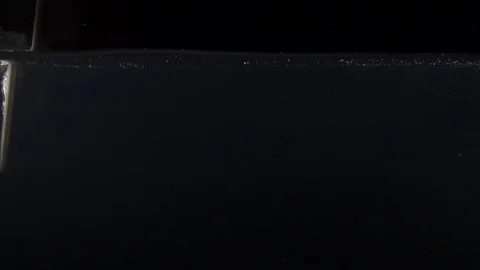 Closeup of mixing water on the black background Stock Footage 75789599
