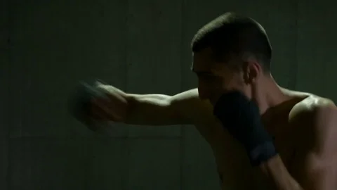 Closeup of MMA fighter boxing at training studio preparing for championship m Stock Footage 77795377