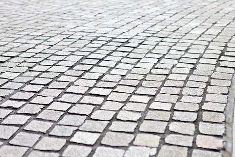 Closeup of a modern and empty detailed stone tile street Stock Photos