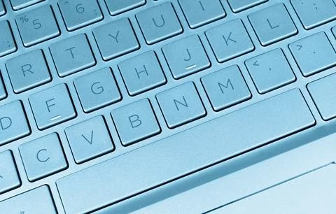 Closeup of a modern blue computer keyboard keys. Close up view of a business Stock-Fotos