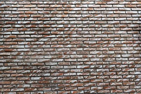 Closeup of modern brick wall pattern background in modern building Photos