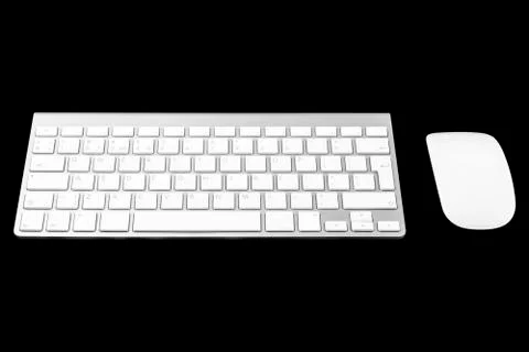 Closeup of a modern computer keyboard and mouse isolated on black background. Foto stock