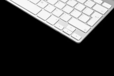 Closeup of a modern computer keyboard isolated on black background. Close up Stock Photos