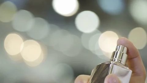 Closeup Modern Exclusive Perfume Sprayed by Woman Hand Stockbeeldmateriaal 75957324