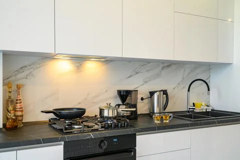 Closeup to modern kitchen cupboard Stock Photos