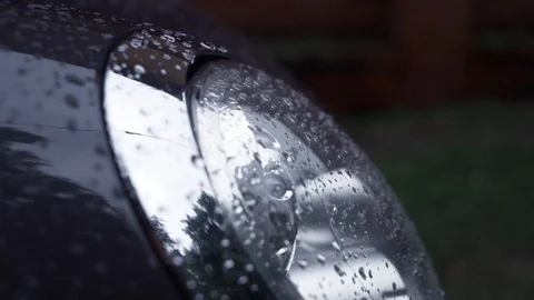 Closeup of modern new car with blinking headlights is being left in the empty Stock Footage 112796178