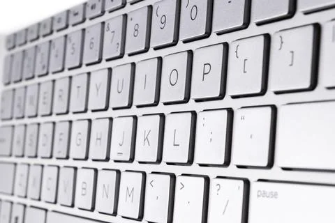 Closeup of a modern silver laptop computer keyboard. Laptop keyboard. Detai.. Foto stock