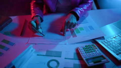 Closeup on modern woman with documents exploring charts Stock Footage 236777981