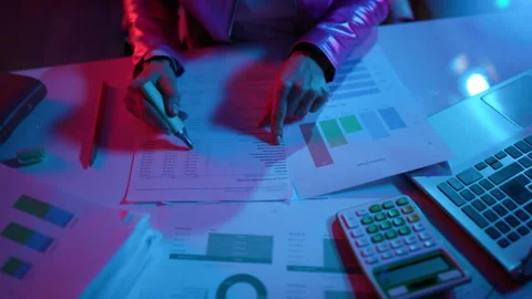 Closeup on modern woman with documents exploring graphs Stock Footage 248180880