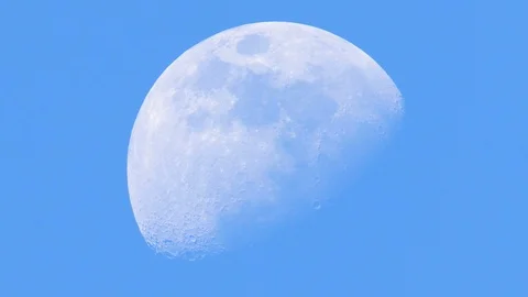 Closeup of moon in blue sky background. Video stock 102663347