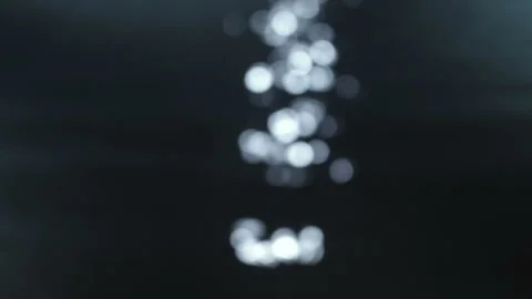 Closeup of a moonlit path bokeh on the water surface of a river. Vídeo Stock 115581746