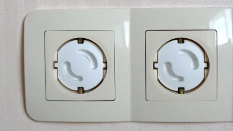 Closeup motion shot of two sockets with white caps Stock Footage 134192795